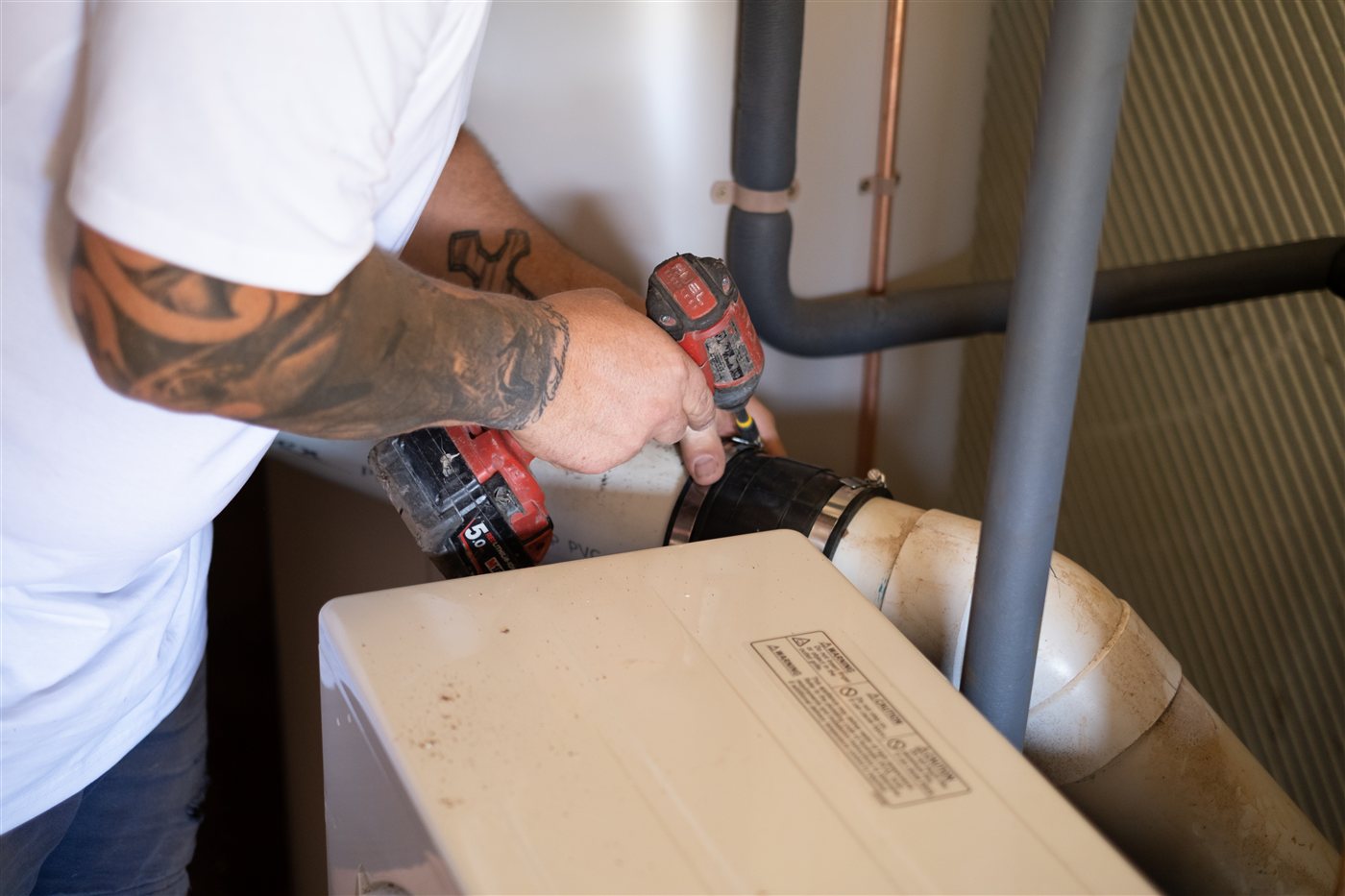 Geelong Heat Pumps installer plumbing in a heat pump